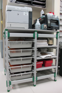 H+H FlexShelf workstation with ISO modular trays and shelves